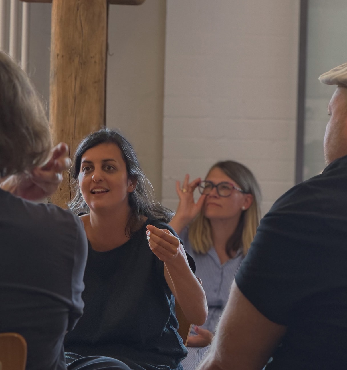 Woman talking to colleagues